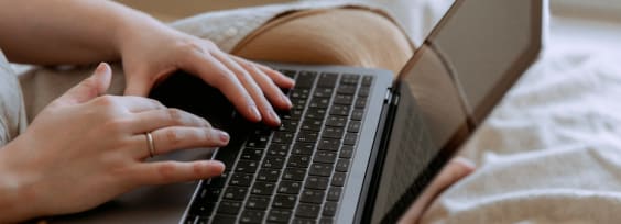 a person typing on a laptop's keyboard