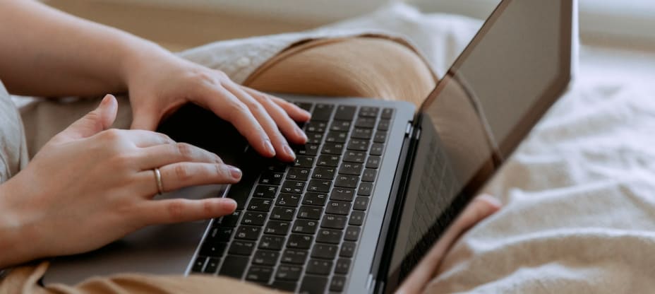 a person typing on a laptop's keyboard