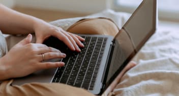 a person typing on a laptop's keyboard