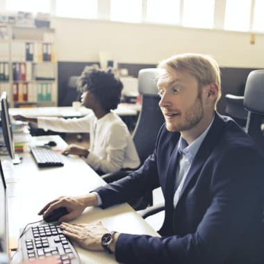 people sitting in front of computers