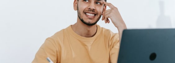 A man sitting at a desk and thinking