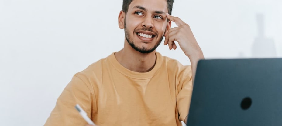 A man sitting at a desk and thinking