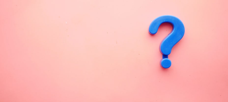 Blue question mark on pink background