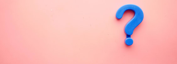 Blue question mark on pink background